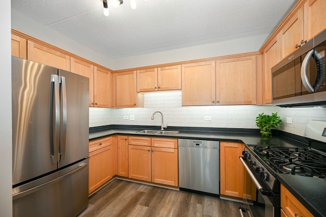 570 Crescent Blvd Unit 307, Glen Ellyn, IL 60137 - kitchen with stainless steel appliances, dark countertops, dark wood-type flooring, decorative backsplash, and a textured ceiling