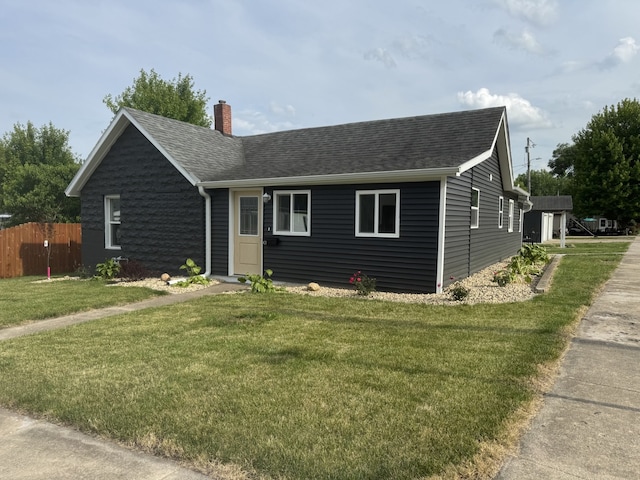 401 E 1st St, Oglesby, IL 61348 - view of front of property featuring a chimney and roof with shingles