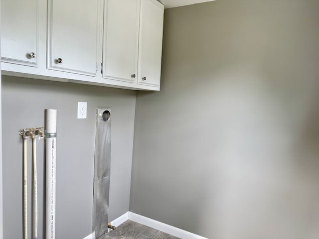 401 E 1st St, Oglesby, IL 61348 - laundry room featuring hookup for an electric dryer and cabinet space