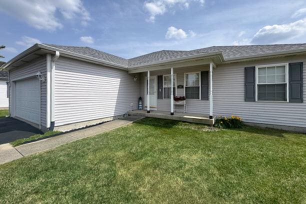 645 Tally St, Earlville, IL 60518 - ranch-style home featuring covered porch, an attached garage, a front lawn, and driveway