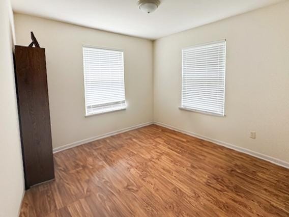645 Tally St, Earlville, IL 60518 - unfurnished room featuring wood finished floors and baseboards
