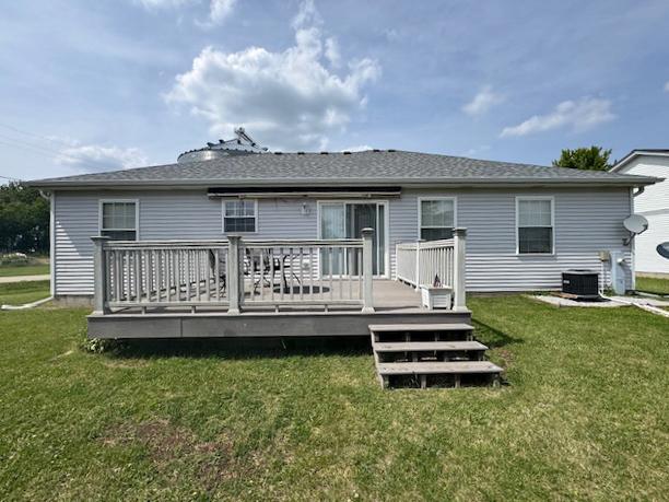 645 Tally St, Earlville, IL 60518 - rear view of property featuring a lawn and a wooden deck
