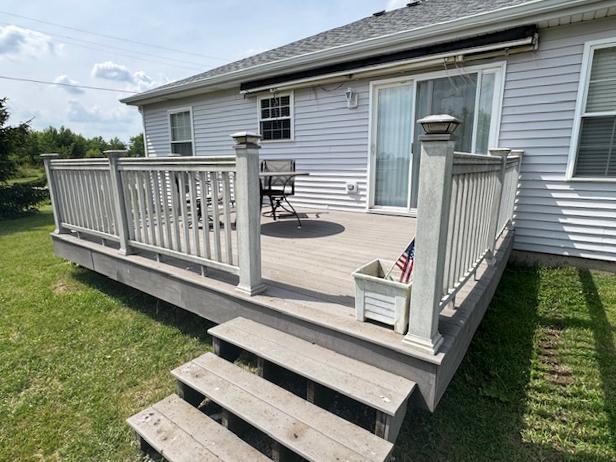 645 Tally St, Earlville, IL 60518 - deck with a lawn