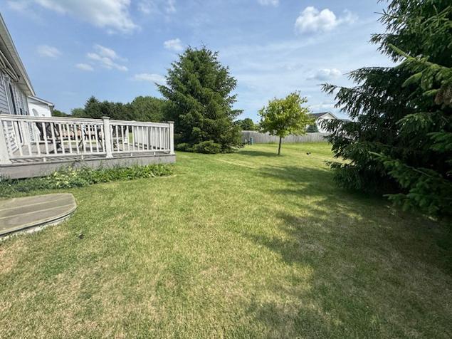 645 Tally St, Earlville, IL 60518 - view of green lawn featuring a wooden deck