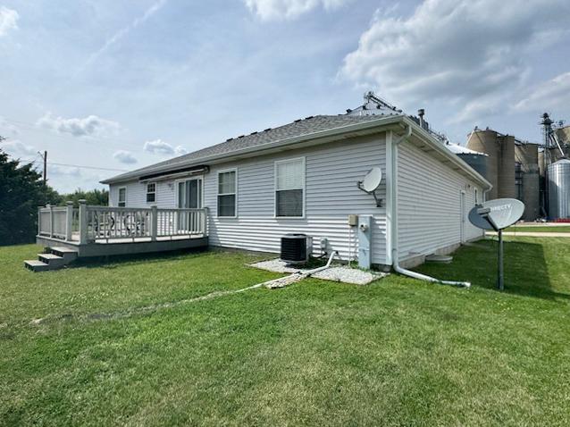 645 Tally St, Earlville, IL 60518 - back of property with a deck and a lawn