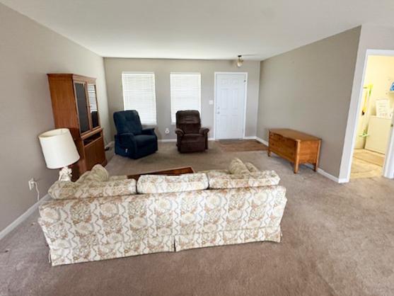 645 Tally St, Earlville, IL 60518 - carpeted living area featuring baseboards