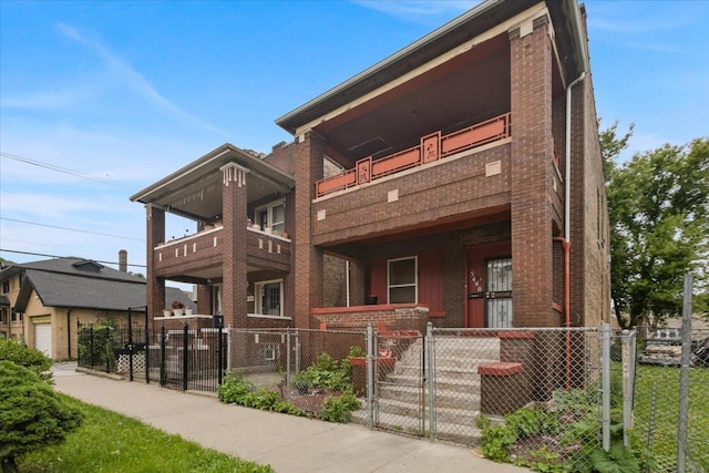 5440 S Paulina St, Chicago, IL 60609 - view of front of home with brick siding, a gate, a fenced front yard, a balcony, and covered porch