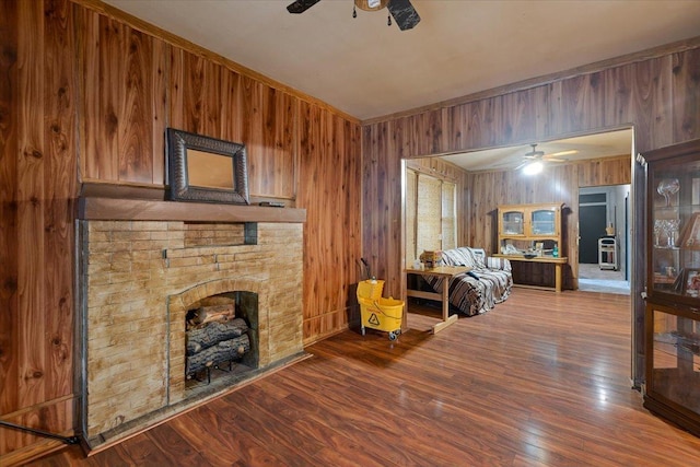 5440 S Paulina St, Chicago, IL 60609 - living area with ceiling fan, wooden walls, wood finished floors, and a fireplace