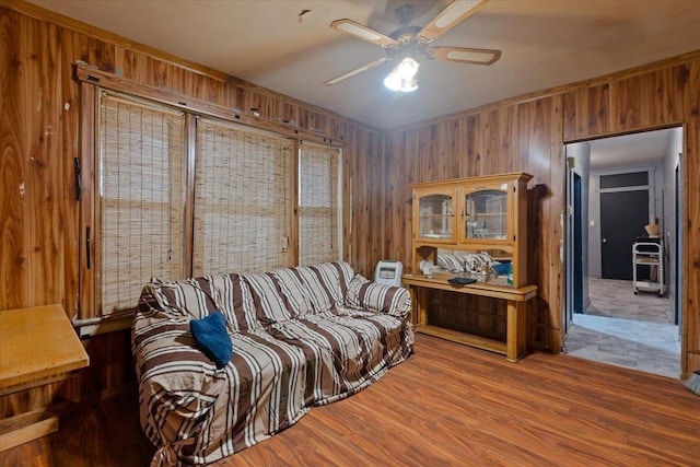 5440 S Paulina St, Chicago, IL 60609 - living room with wood walls, ceiling fan, and wood finished floors