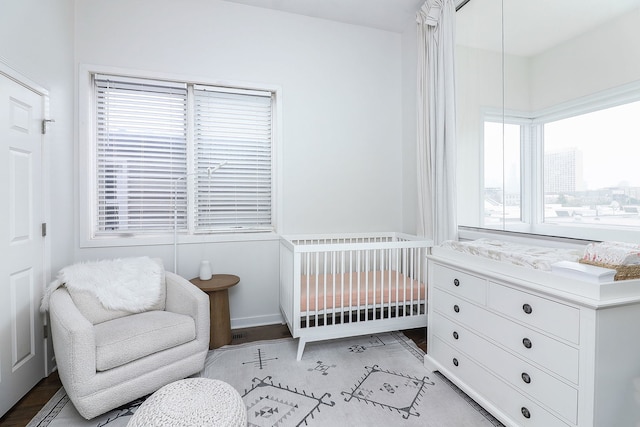 1644 W Blackhawk St Unit 2E, Chicago, IL 60622 - bedroom with a nursery area and baseboards