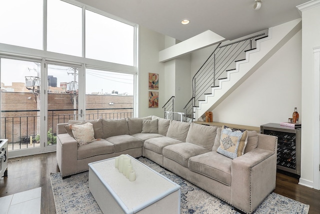 1644 W Blackhawk St Unit 2E, Chicago, IL 60622 - living room featuring beverage cooler, recessed lighting, wood finished floors, and stairway