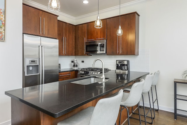 1644 W Blackhawk St Unit 2E, Chicago, IL 60622 - kitchen with stainless steel appliances, a peninsula, decorative backsplash, a breakfast bar, and crown molding