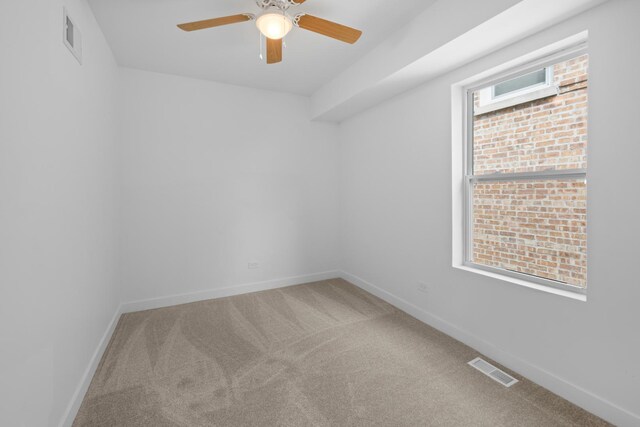 8317 S Constance Ave, Chicago, IL 60617 - carpeted spare room featuring a ceiling fan and baseboards