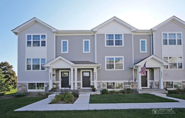6650 Linden Trl Unit B, Wonder Lake, IL 60097 - townhome / multi-family property with stone siding and a front yard