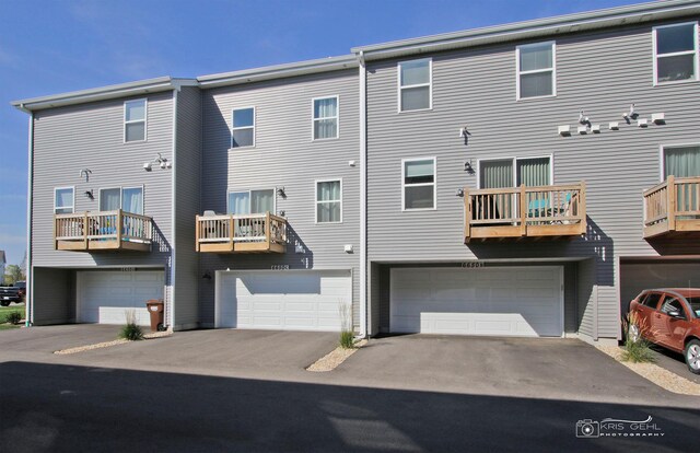 6650 Linden Trl Unit B, Wonder Lake, IL 60097 - back of house with a garage and driveway