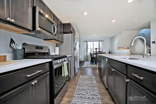 6650 Linden Trl Unit B, Wonder Lake, IL 60097 - kitchen featuring stainless steel appliances, light countertops, dark wood-type flooring, and recessed lighting