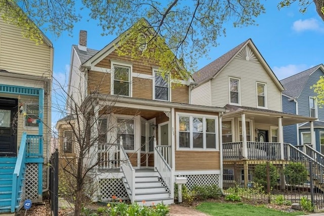 3739 W Palmer St, Chicago, IL 60647 - view of front of house with a porch, a chimney, and stairs