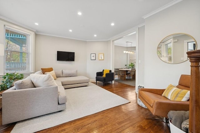 3739 W Palmer St, Chicago, IL 60647 - living area featuring wood finished floors, ornamental molding, and recessed lighting