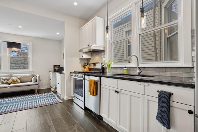 3739 W Palmer St, Chicago, IL 60647 - kitchen featuring stainless steel range oven, plenty of natural light, under cabinet range hood, backsplash, and recessed lighting