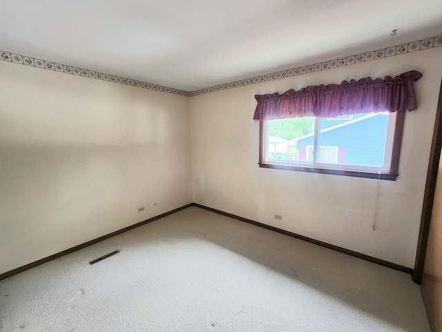 624 Maple Ave, Lisle, IL 60532 - carpeted spare room featuring baseboards