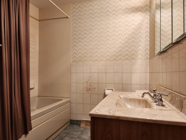 624 Maple Ave, Lisle, IL 60532 - bathroom with tile walls, vanity, wallpapered walls, and tile patterned floors