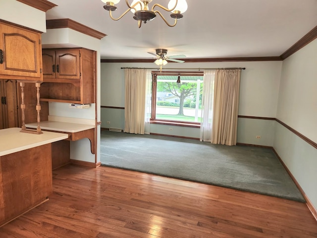 624 Maple Ave, Lisle, IL 60532 - kitchen featuring a chandelier, brown cabinets, crown molding, light countertops, and wood finished floors
