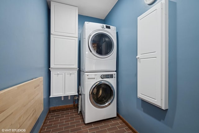 42 N Holly Ave, Fox Lake, IL 60020 - laundry room featuring stacked washer / dryer and cabinet space