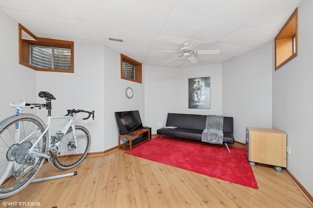42 N Holly Ave, Fox Lake, IL 60020 - living area featuring wood finished floors, ceiling fan, and a drop ceiling