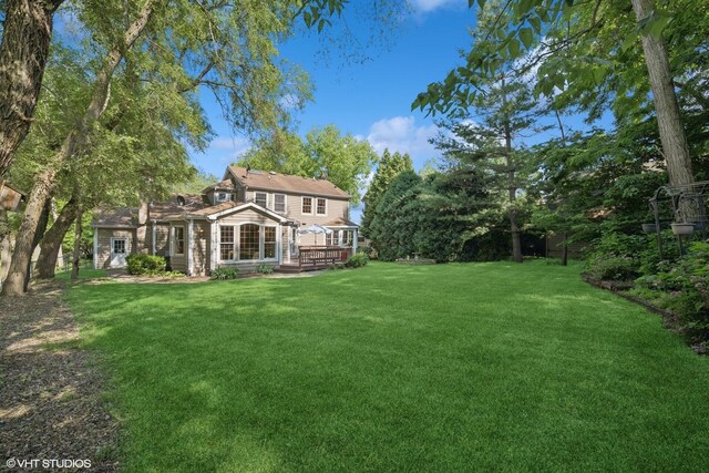 42 N Holly Ave, Fox Lake, IL 60020 - view of grassy yard with a deck