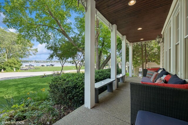 42 N Holly Ave, Fox Lake, IL 60020 - covered porch featuring a yard
