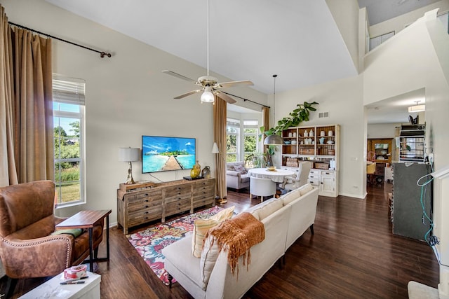 361 Cascade Ln Unit 1, Oswego, IL 60543 - living room featuring dark wood finished floors, ceiling fan, and a high ceiling