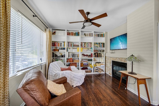 361 Cascade Ln Unit 1, Oswego, IL 60543 - living area featuring wood finished floors, ceiling fan, and a glass covered fireplace