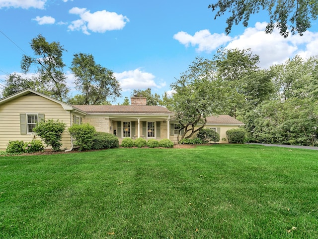915 Ray St, Geneva, IL 60134 - ranch-style home with a chimney and a front lawn