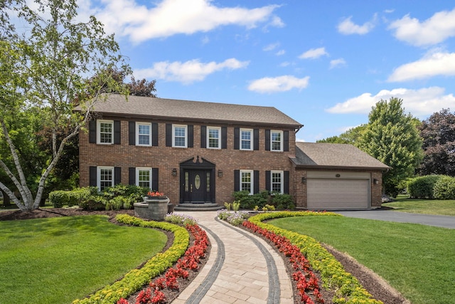 1401 Fallcreek Ct, Naperville, IL 60565 - colonial home featuring an attached garage, brick siding, asphalt driveway, and a front yard