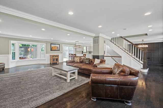 1401 Fallcreek Ct, Naperville, IL 60565 - living area featuring a chandelier, a decorative wall, crown molding, stairs, and wood finished floors