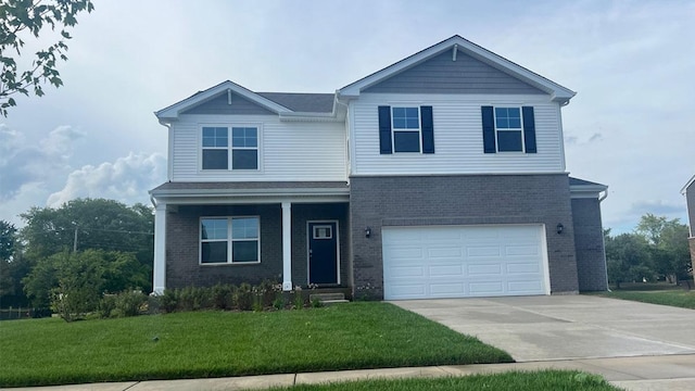 15030 W Oxford Ln, Manhattan, IL 60442 - view of front facade with brick siding, a front lawn, a garage, driveway, and a porch