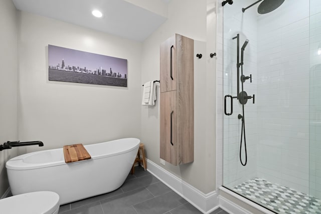 841 W Monroe St Unit 4A, Chicago, IL 60607 - bathroom featuring a freestanding tub, a stall shower, and tile patterned flooring