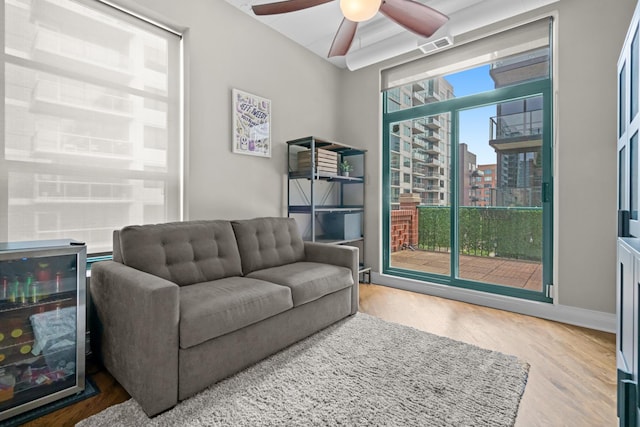 841 W Monroe St Unit 4A, Chicago, IL 60607 - living area with wood finished floors, ceiling fan, and a city view