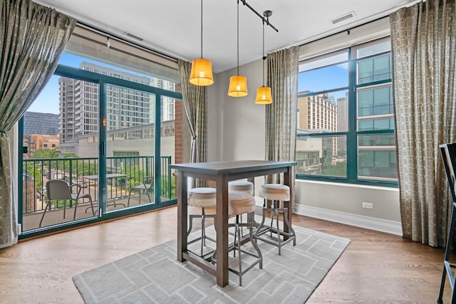 841 W Monroe St Unit 4A, Chicago, IL 60607 - dining space with a city view and wood finished floors