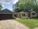 2075 Halsey Dr, Des Plaines, IL 60018 - single story home featuring a garage, driveway, and a front lawn