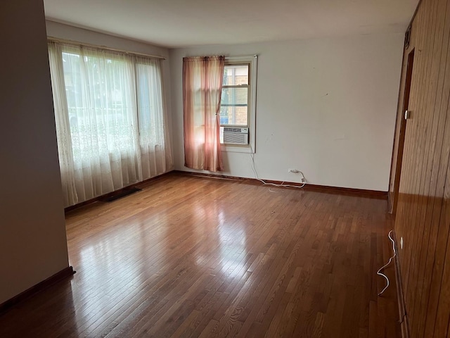 2075 Halsey Dr, Des Plaines, IL 60018 - spare room featuring wood finished floors and cooling unit