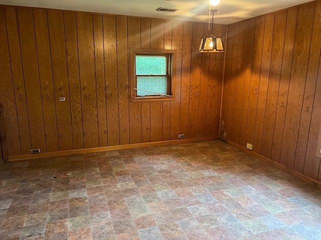 2075 Halsey Dr, Des Plaines, IL 60018 - empty room with stone finish floors and wood walls