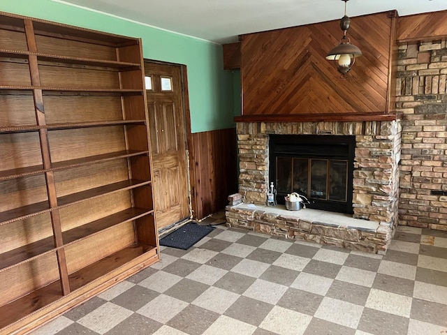 2075 Halsey Dr, Des Plaines, IL 60018 - unfurnished living room featuring wainscoting, wooden walls, a glass covered fireplace, and tile patterned floors