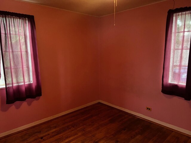 2075 Halsey Dr, Des Plaines, IL 60018 - unfurnished room with dark wood-style floors, healthy amount of natural light, and ornamental molding