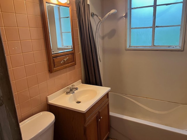 2075 Halsey Dr, Des Plaines, IL 60018 - bathroom featuring vanity, tile walls, and shower / tub combo with curtain