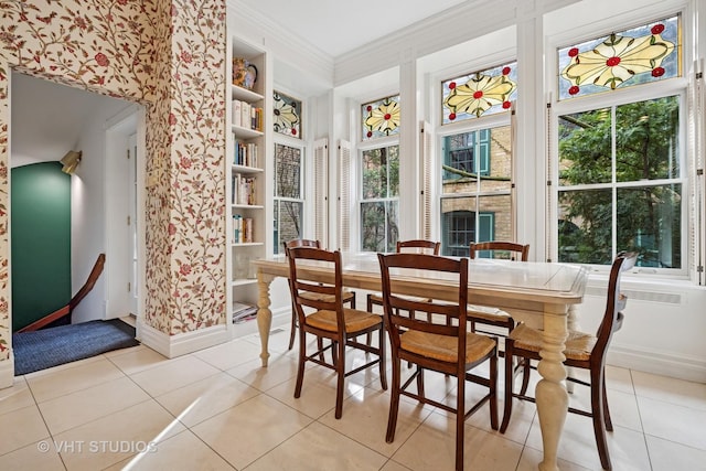 2124 N Cleveland Ave, Chicago, IL 60614 - dining area featuring light tile patterned floors, built in features, and crown molding