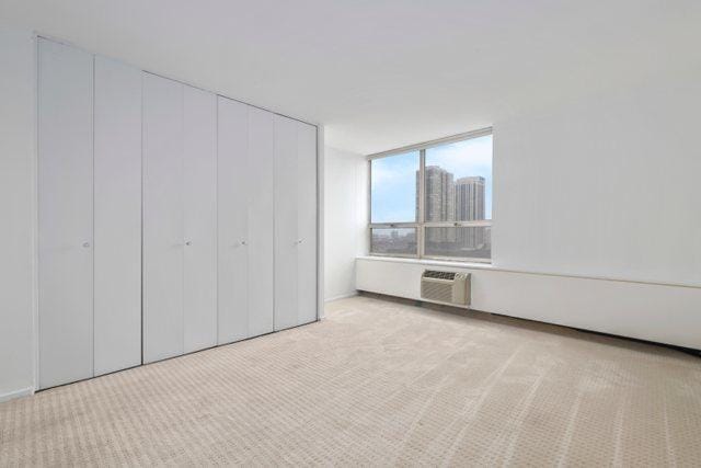 70 W Burton Pl Unit 1801, Chicago, IL 60610 - unfurnished bedroom featuring carpet and a closet
