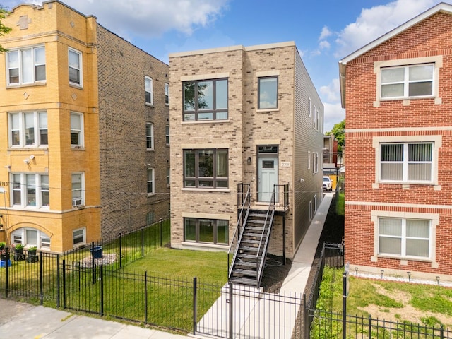 2708 W Jackson Blvd, Chicago, IL 60612 - view of front of house featuring brick siding and a fenced backyard