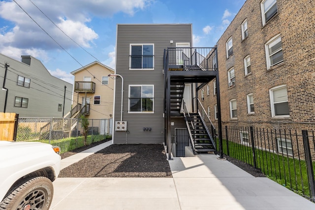 2708 W Jackson Blvd, Chicago, IL 60612 - view of front of home with stairway and a wooden deck