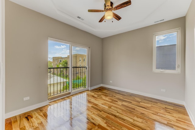 2708 W Jackson Blvd, Chicago, IL 60612 - spare room with healthy amount of natural light, wood finished floors, and ceiling fan